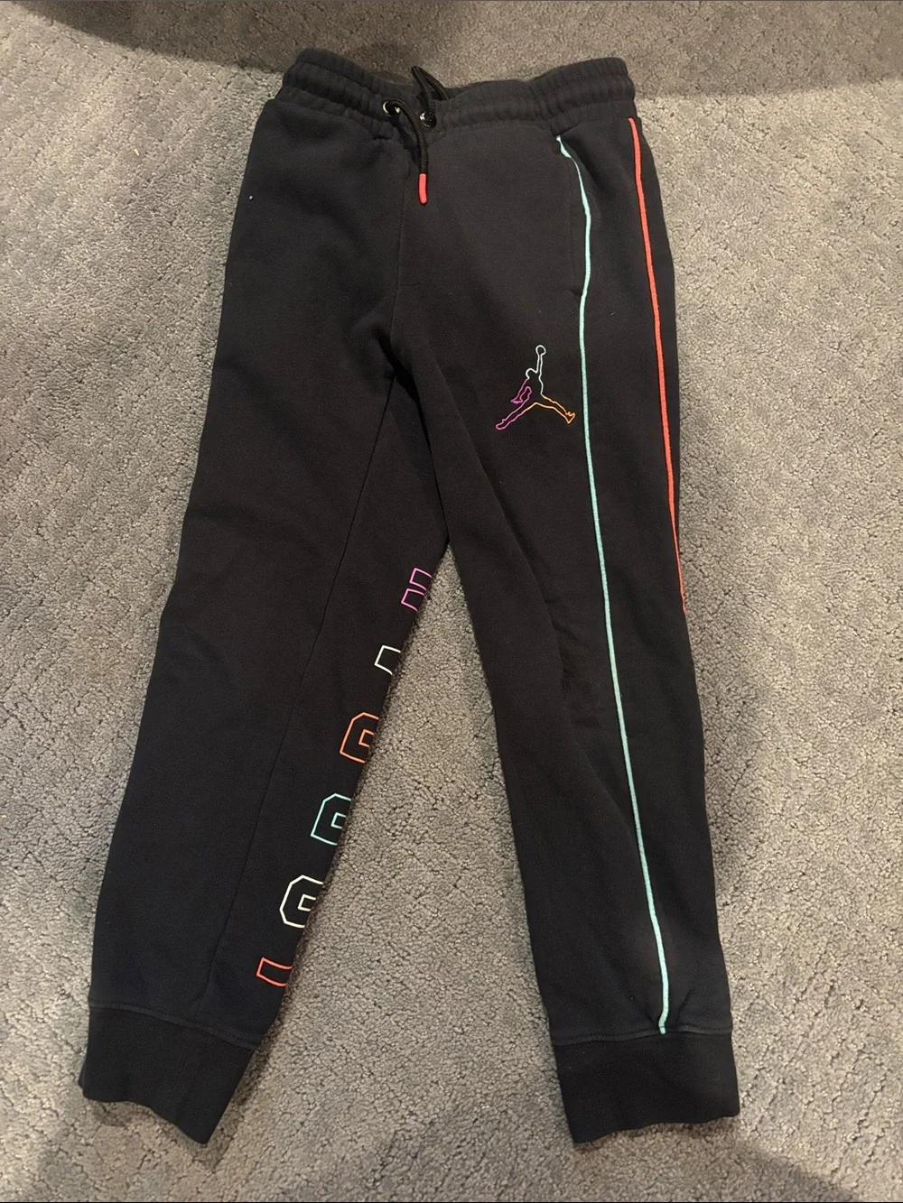 Nike Jordan black multi color logo sweat outfit with mini tear in right leg